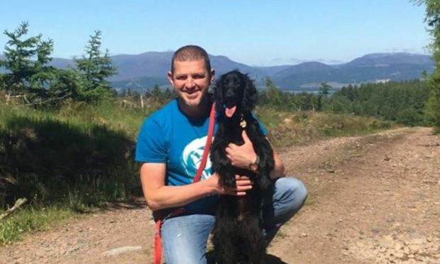 Neil Lancaster with his dog, Peggy, at home in the Black Isle.