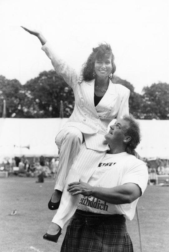 Francis Brebner holds Linda Lusardi on his shoulder after she opened Meldrum Sports in 1993