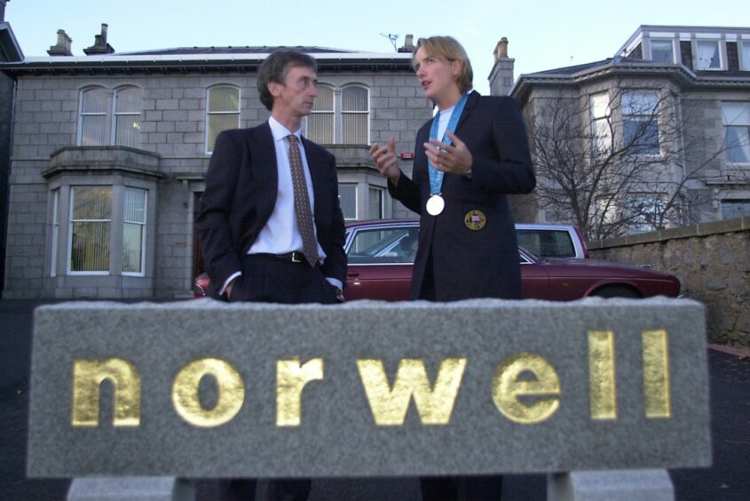 Olympic medallist Dame Katherine Grainger helps Norwell's Ken Fraser open offices on Queens Road, Aberdeen, in November 2000