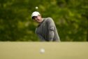Rory McIlroy, of Northern Ireland, chips to the green on the 14th hole during a practice around for the PGA Championship golf tournament at Oak Hill Country Club on Tuesday, May 16, 2023, in Rochester, N.Y. (AP Photo/Eric Gay)