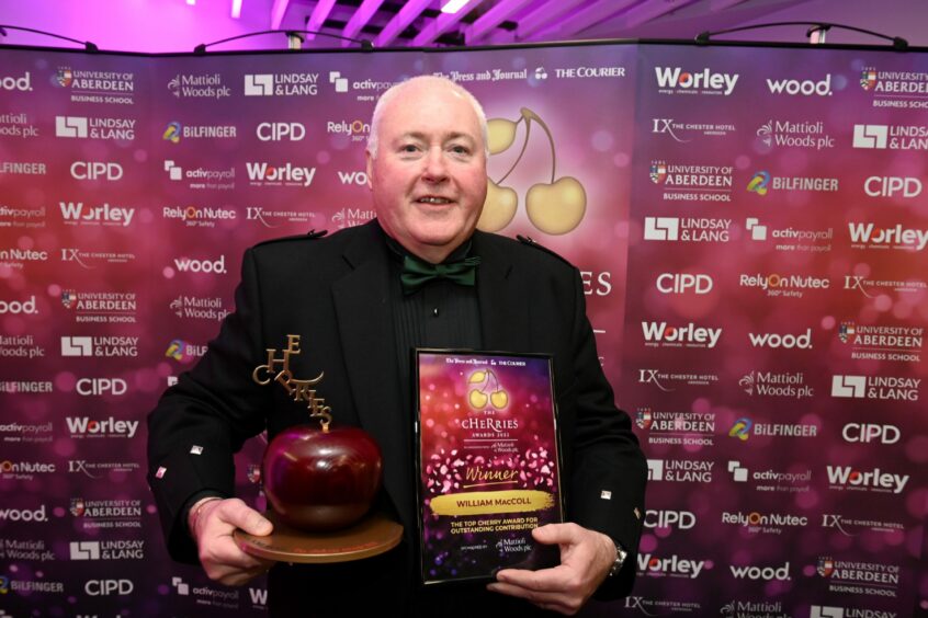 Willie MacColl with the 2022 top cHeRry trophy