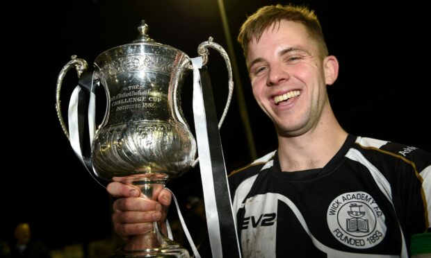 Alan Farquhar pictured with the North of Scotland Cup after Wick's triumph in 2015.