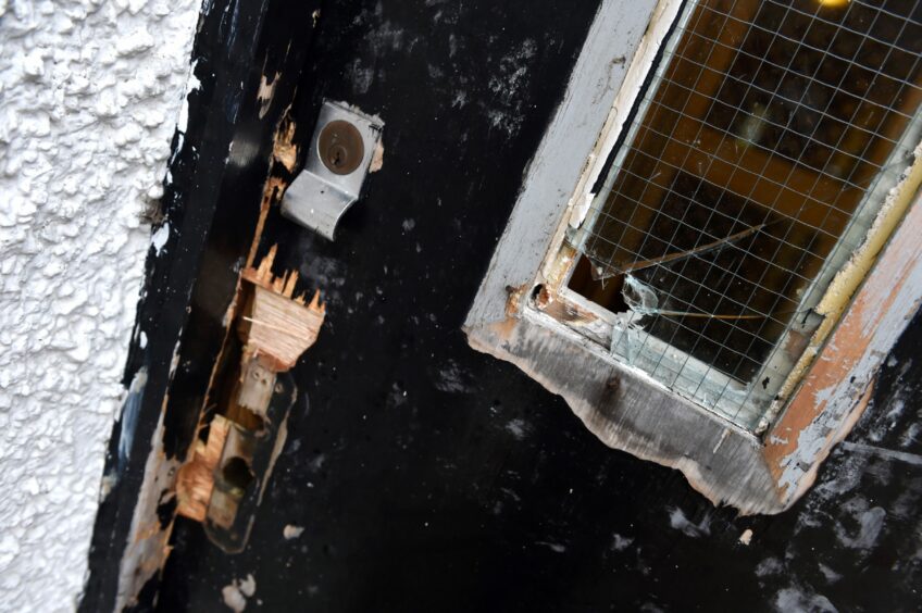 Council tenants could be stumped with a bill to repair their broken doors if they don't allow workers in to make home improvements. Image: Kenny Elrick/DC Thomson.