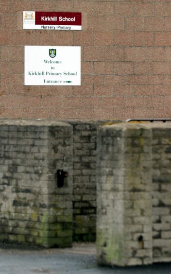 A photo showing a welcome sign on a brick wall for Kirkhill School and nursery.