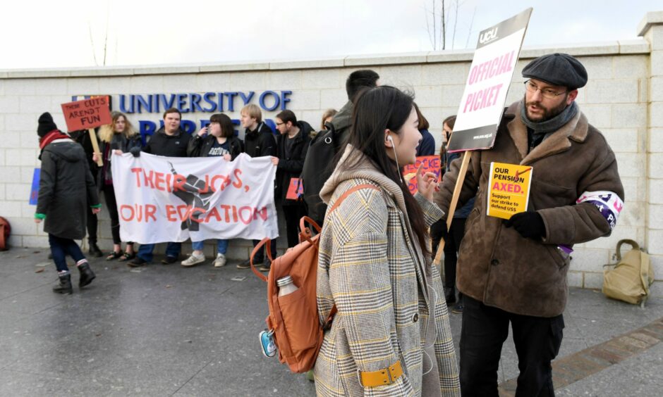 UCU members striking outside the entrance of Aberdeen University.