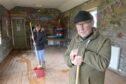 Pamela Winchester of the Aberlour Community Association and Ben Hinnie of the Aberlour Visitor Centre in the badly damaged tearooms. Image: Sandy McCook/DC Thomson