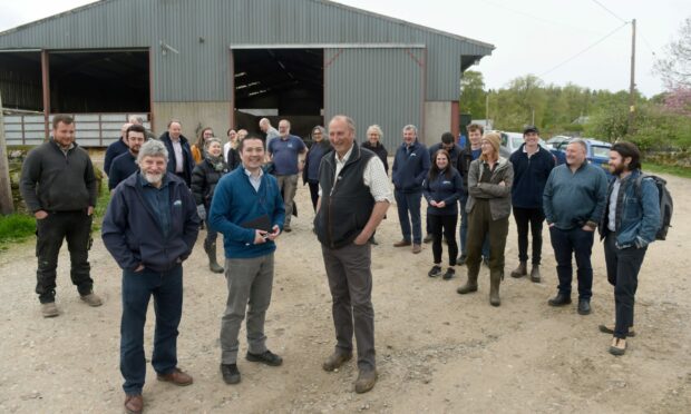 Members of the commission with in the foreground Martin Kennedy NFUS, Lang Banks of the Commission and Robert Macdonald of Castle Grant Home Farm. Image: Sandy McCook.