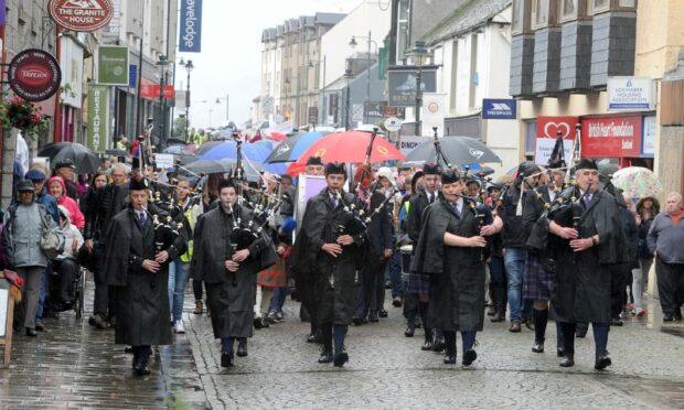 The pipe band marched along Fort William High Street as the Mod got under way in 2017.