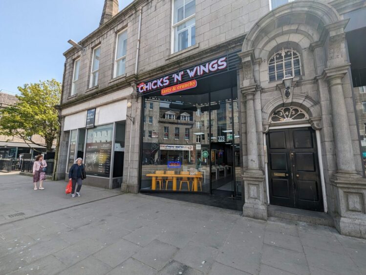 Aberdeen planning enforcement staff issued a notice for 339 Union Street. The ground floor is occupied by Chicks 'n' Wings. Image: Alastair Gossip/DC Thomson.