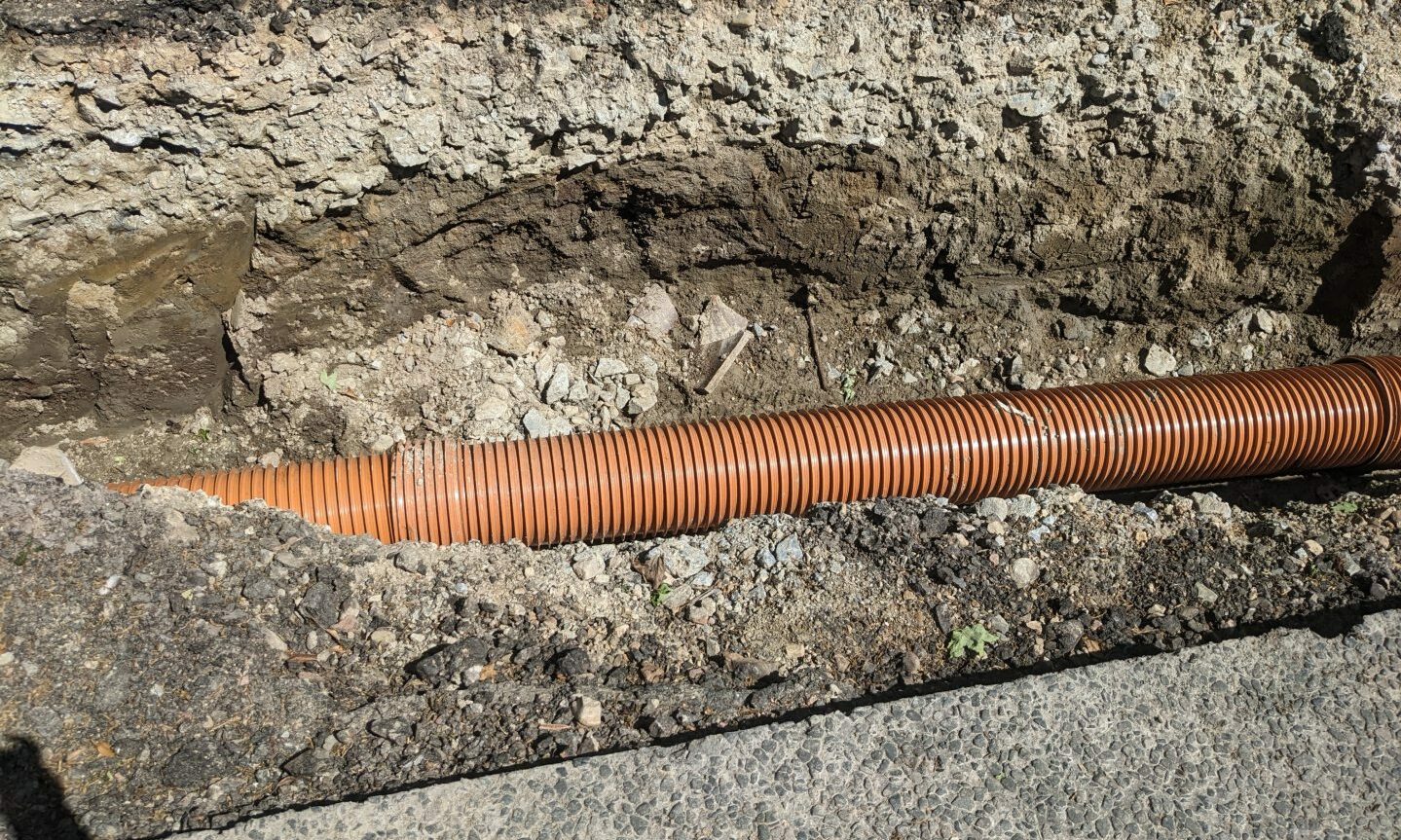 Close-up of new section of pipe. 