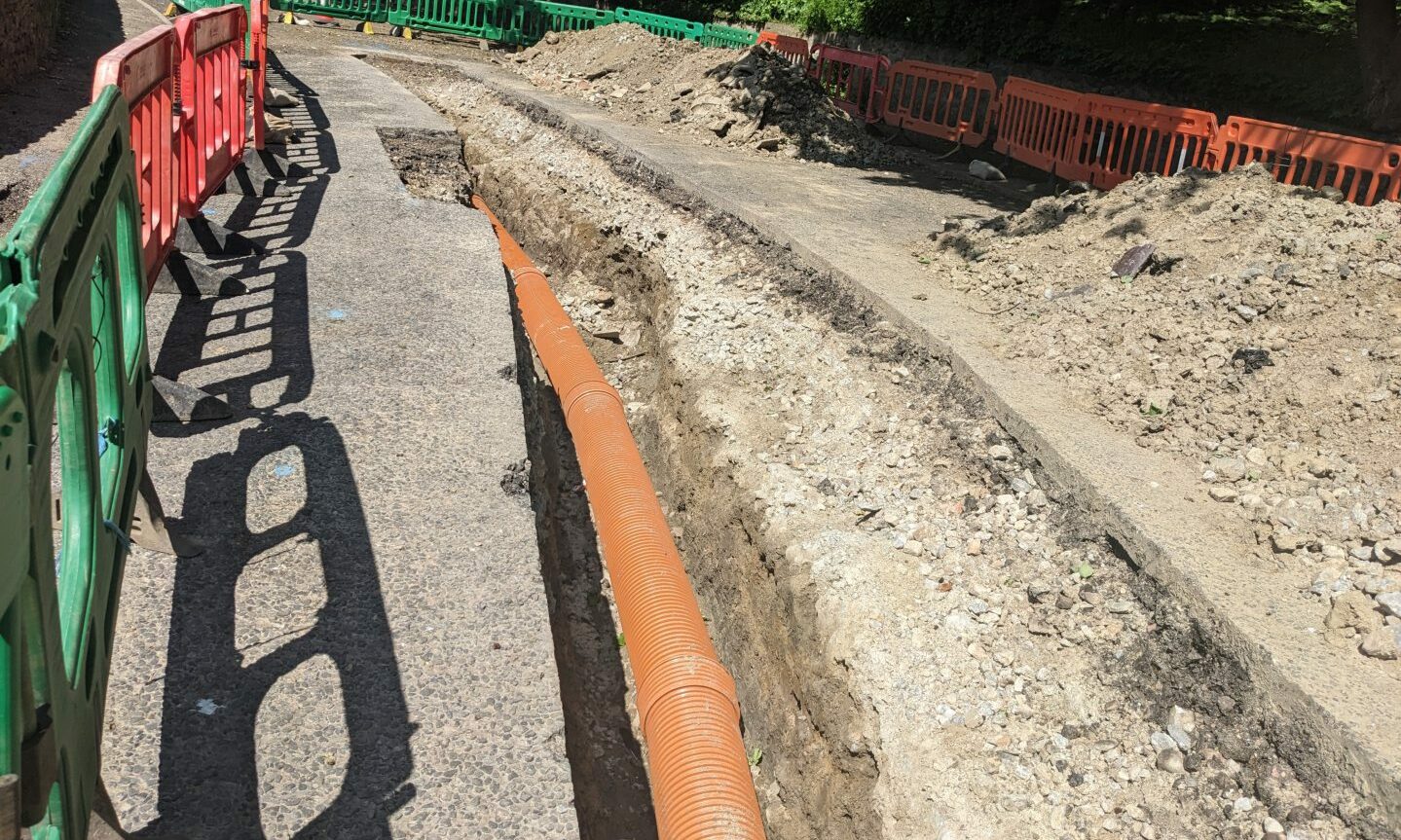 Large trench in Fife Street showing the new pipe underground. 