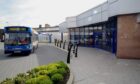 A blue bus parked outside the interchange in Peterhead