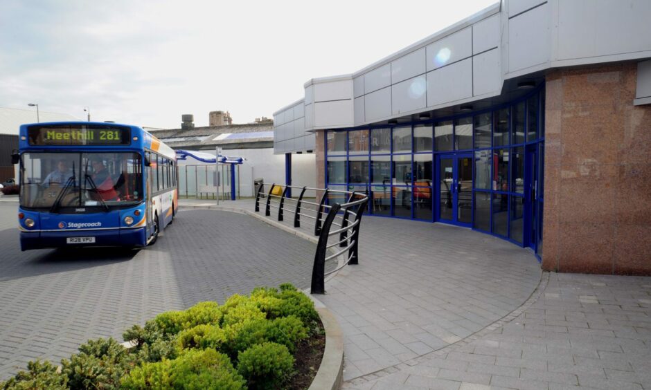 A blue bus parked outside the interchange in Peterhead
