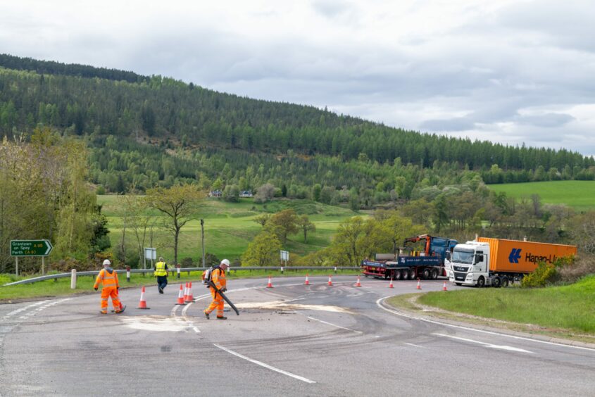 The scene of the crash between the lorry and bus on the A95 at Bridge of Avon with the road being closed. 