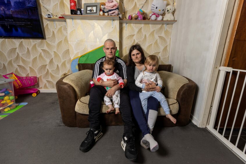 Andrew and Sarahjane Wardhaugh with their children Amber Rose and Amy Louise in their infested Tillydrone flat.