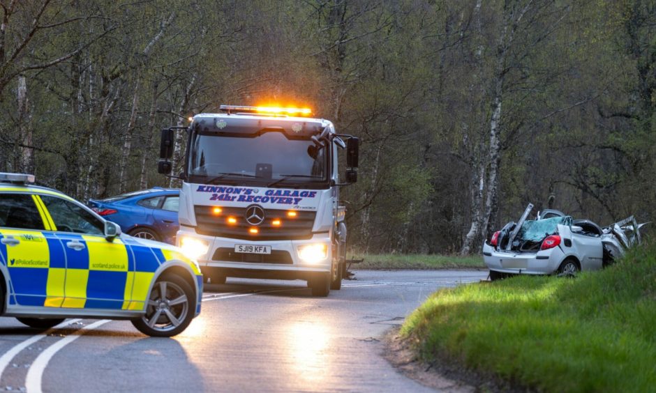 Police on the A93 Ballater to Aberdeen road at Cambus O'May after the head-on crash.