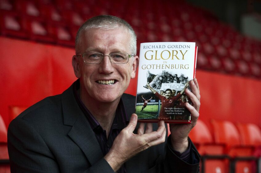 Richard Gordon with his book about Aberdeen's win in Gothenburg. Image: SNS.