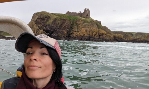 Gayle enjoys views of Dunnottar Castle from the boat.