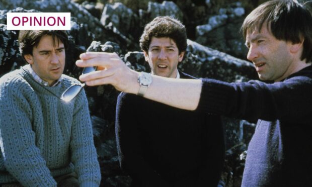 From left to right, actors Denis Lawson and Peter Riegert ad director Bill Forsyth on the set of Local Hero in 1983 (Image: Enigma/Goldcrest/Kobal/Shutterstock)