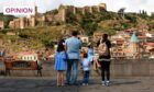 A family enjoying beautiful views in Tbilisi, Georgia (Image: Ukrolenochka/Shutterstock)