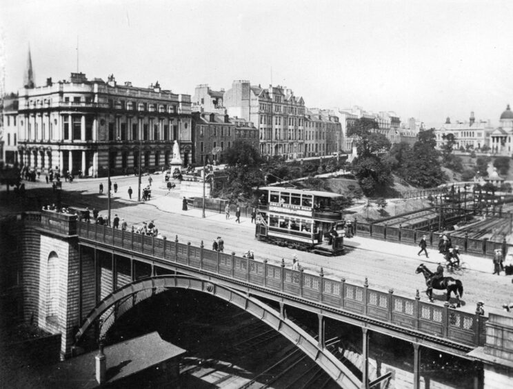 An Aberdeen tram trundling its way across Union Bridge with Union Terrace Gardens in the background. Image: DC Thomson, circa 1914.