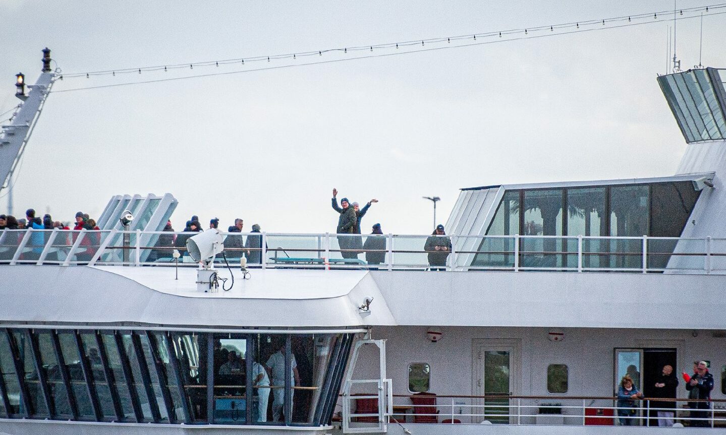 Tourists aboard the Aida Aura cruise ship, which arrived in Aberdeen on May 2, wave to their welcome party. It was the first cruise ship to arrive at the new south harbour. Could passengers be subject to a tourist tax in the future?
