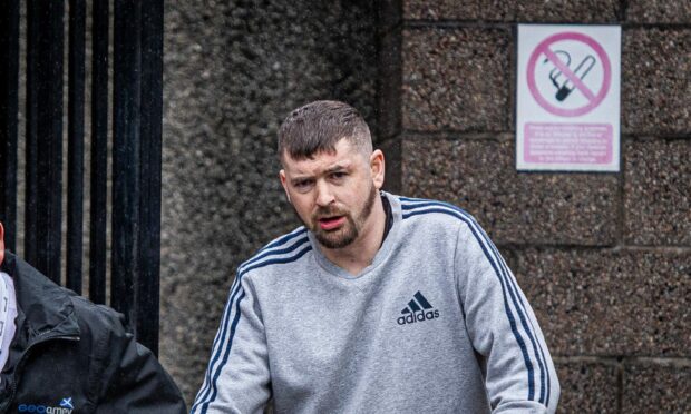Tony Emslie is taken back to prison from Aberdeen Sheriff Court. Image: DC Thomson/ Wullie Marr