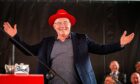 Legendary Aberdeen captain Willie Miller wearing the Reds-themed hat he had to "Don" for Friday's Freedom of the City event. Image: Wullie Marr/DC Thomson