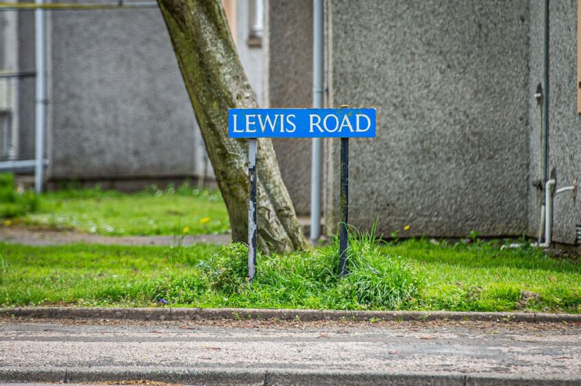 Road sign on Lewis Road where police were seen responded to concern for a person. 