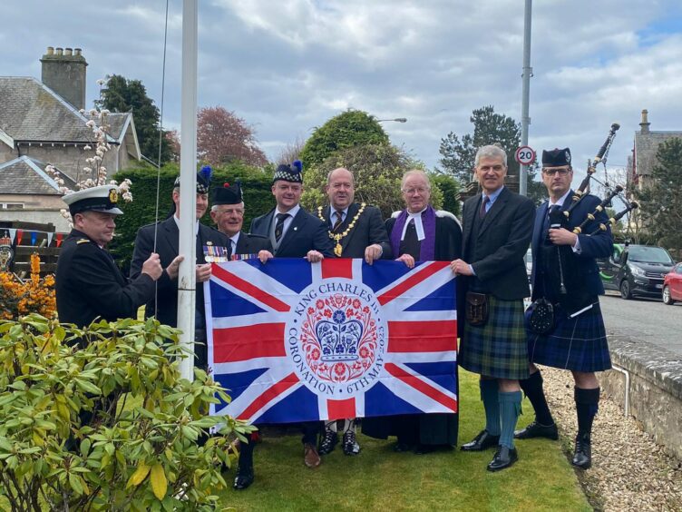 Veterans, military personnel and members of the public attended a flag-raising at the Royal British Legion in Nairn.