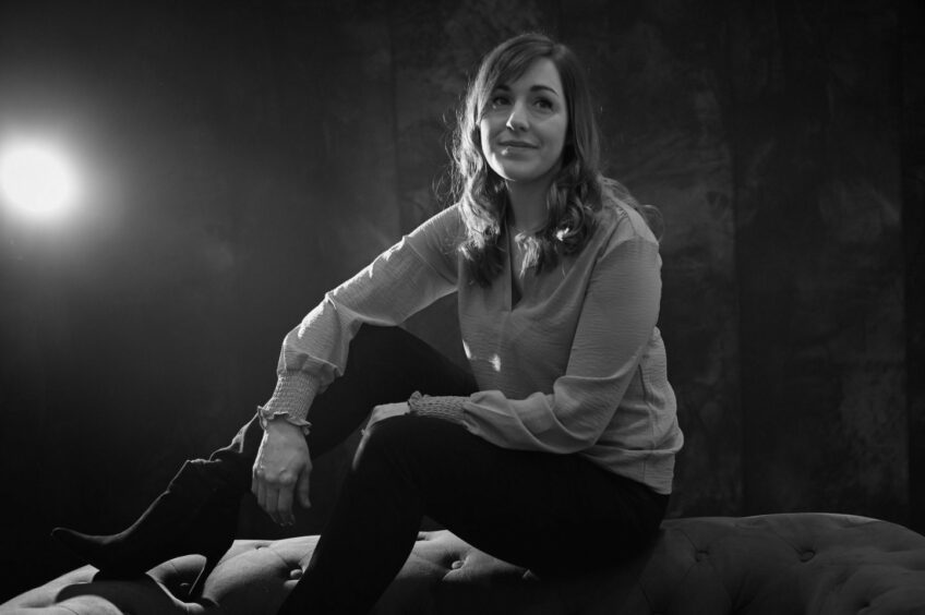 A black and white image of Jennifer Masala sitting