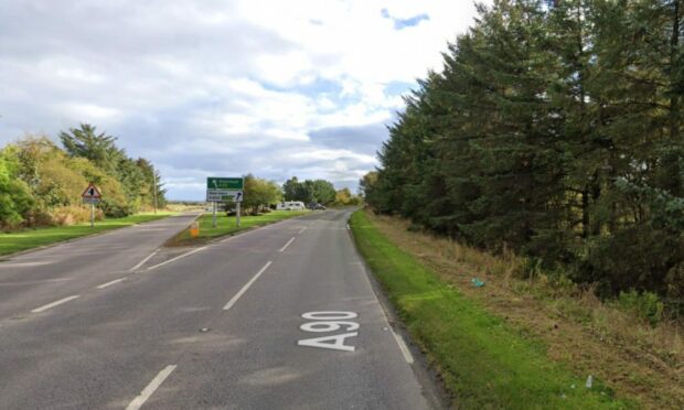 A photo of the A90 road on a bright day at the Cortes Junction in Aberdeenshire.