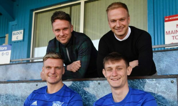 Peterhead co-managers Ryan Strachan and Jordon Brown, back row left to right, with Jason Brown and Danny Strachan after the duo signed new three-year deals. Image: Peterhead FC