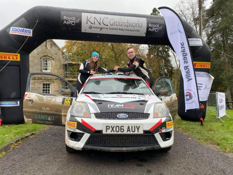 Emily Easton-Page and Johnnie Mackay pictured with their rally car after winning the junior title. 