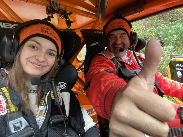 Emily Easton-Page and her dad Martin Page inside a rally car. 