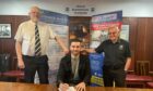 Elgin City directors Chris Foot, left, and Cecil Jack, right, with new manager Ross Draper as he signs his three-year contract.