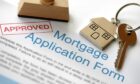 Approved Mortgage loan application with house key and rubber stamp; Shutterstock ID 114626293; purchase_order: ; job: