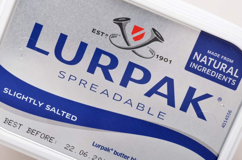 Lurpak butter, a popular brand sold at different prices across various supermarkets in the UK.