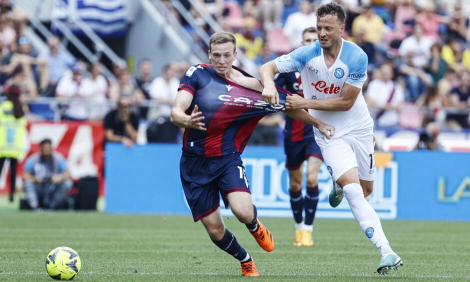 Bologna's Lewis Ferguson and Napoli's Amir Rrahmani in action in a Serie A match