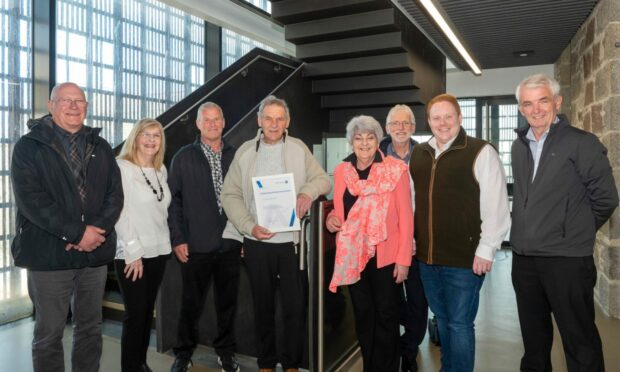 Brian Third is pictured receiving his Best of Banff and Buchan Award from local councillors Richard Menard and area chair Doreen Mair (left) and Ann Bell and James Adams (third and second right). Image: Aberdeenshire Council.