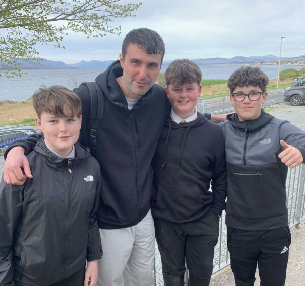 DJ Fred Again with three teenagers in Broadford Skye.
