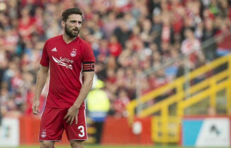 Graeme Shinnie wearing Aberdeen's 2017/18 home kit.