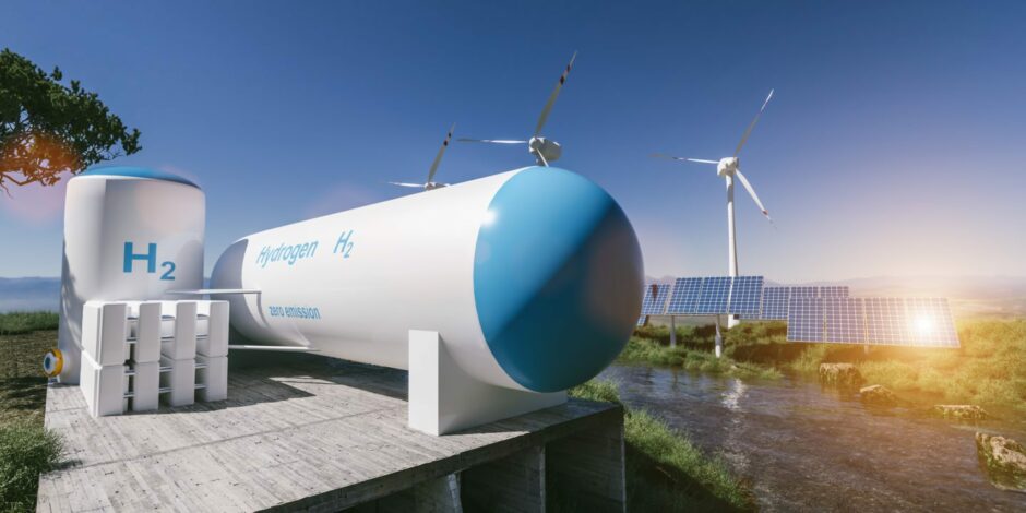 Hydrogen tank with wind turbines in the background.