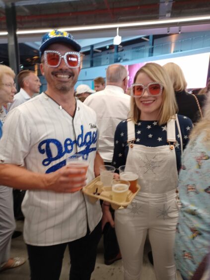 Austin and Charley Ward. Austin is wearing a replica LA Dodger’s shirt with Elton 1 on the back and they are both wearing Elton John sunglasses