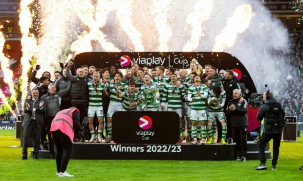 Celtic's Callum McGregor lifts the Viaplay Cup. Imge: SNS.