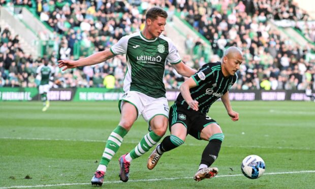 Manchester United defender Will Fish in action for Hibs during a loan spell. Image-SNS