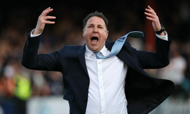 Malky Mackay celebrates Ross County's play-off win against Partick Thistle. Image: SNS