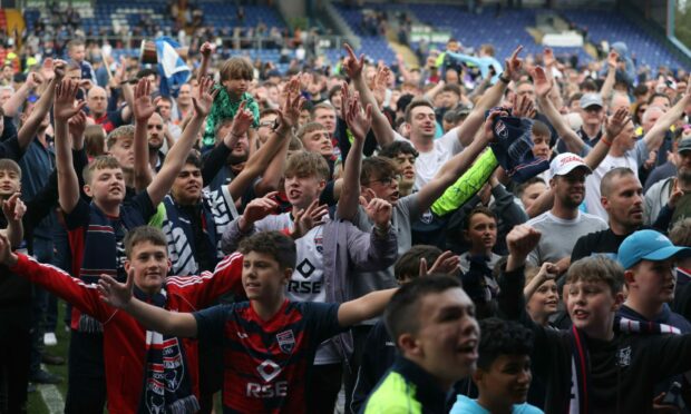 The Ross County fans celebrate after their side saw off Partick Thistle in the Premiership play-off final. Image: SNS