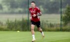 Angus MacDonald taking part in an Aberdeen training session. Image: SNS.