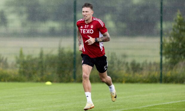 Angus MacDonald taking part in an Aberdeen training session. Image: SNS.